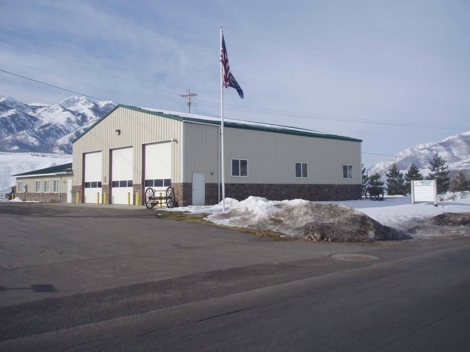 Mountain Green Fire District building with snow and mountains in the background.