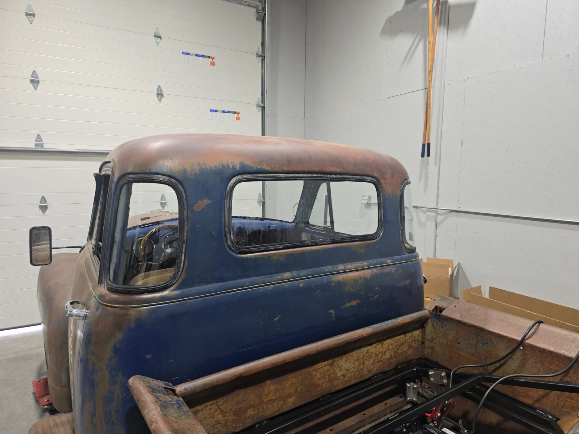 Rusty vintage blue pickup truck cab and bed